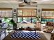 Bright living room featuring large windows, natural light, modern decor, and comfortable seating, for a stylish atmosphere at 4718 Crystal Ave, Sarasota, FL 34231