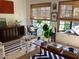 Bright living room with natural light from windows, a comfortable seating area and views of the landscape at 4718 Crystal Ave, Sarasota, FL 34231