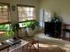 Cozy living room featuring natural light, stylish decor, and comfortable seating, perfect for relaxation and entertaining at 4718 Crystal Ave, Sarasota, FL 34231