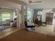Bright open-concept living room, dining room and kitchen with contemporary furnishings and stylish decor at 4718 Crystal Ave, Sarasota, FL 34231