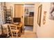 Through an office, a glimpse of the comfortable living area creates an inviting, relaxed atmosphere at 7713 39Th N Ave, St Petersburg, FL 33709