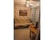 A cozy bedroom features a futon and a desk, ideal for a home office space at 7713 39Th N Ave, St Petersburg, FL 33709
