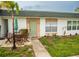 Charming single-story home features a quaint patio area and well-maintained landscaping at 7713 39Th N Ave, St Petersburg, FL 33709