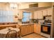 Cozy kitchen featuring ample counter space, essential appliances, and a dining area at 7713 39Th N Ave, St Petersburg, FL 33709