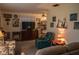 Comfortable living room features a decorative arrangement of artwork and a plush recliner for relaxation at 7713 39Th N Ave, St Petersburg, FL 33709