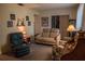 Relaxing living room, furnished with a sofa and comfortable chair, perfect for unwinding at 7713 39Th N Ave, St Petersburg, FL 33709