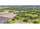 Overhead shot of a sprawling property with fields, greenery, and some residential dwellings at 1309 Joe Mcintosh Rd, Plant City, FL 33565