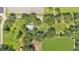 Aerial perspective of a home amidst fields and abundant trees in a rural setting at 1309 Joe Mcintosh Rd, Plant City, FL 33565