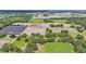 Aerial view of property with home, barn, and open land surrounding the property at 1309 Joe Mcintosh Rd, Plant City, FL 33565