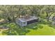 Top-down view of a metal building with a screened porch on a grassy lawn at 1309 Joe Mcintosh Rd, Plant City, FL 33565