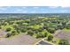 Expansive aerial view of a rural property featuring lush trees and agricultural fields at 1309 Joe Mcintosh Rd, Plant City, FL 33565