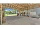 Spacious barn interior with open layout, concrete floor, metal walls, and abundant workspace at 1309 Joe Mcintosh Rd, Plant City, FL 33565
