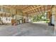 The spacious barn features a concrete floor, metal walls, and a high, exposed beam ceiling at 1309 Joe Mcintosh Rd, Plant City, FL 33565