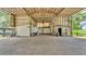 Large barn with concrete flooring, bright lighting, and a spacious open area for versatile use at 1309 Joe Mcintosh Rd, Plant City, FL 33565