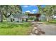 Exterior shot of barn with open middle area that leads to the rest of the property at 1309 Joe Mcintosh Rd, Plant City, FL 33565