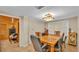 Dining room featuring a table, chairs, a decorative light fixture, and tile flooring at 1309 Joe Mcintosh Rd, Plant City, FL 33565