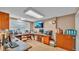 Large office with a flat-screen TV, multiple desks, and ample storage space at 1309 Joe Mcintosh Rd, Plant City, FL 33565