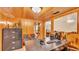Office area with wood paneling, a large desk, and built-in shelves for storage at 1309 Joe Mcintosh Rd, Plant City, FL 33565