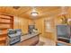 Office space featuring wooden paneling, a desk, and natural light from the window at 1309 Joe Mcintosh Rd, Plant City, FL 33565