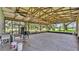 Spacious outdoor screened-in patio area with brick flooring, ceiling fans, and outdoor cooking space at 1309 Joe Mcintosh Rd, Plant City, FL 33565