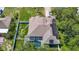 This property features a private pool with screened enclosure and solar panels for energy efficiency at 173 Portland Ave, Spring Hill, FL 34606