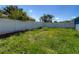 Spacious backyard with a tall privacy fence at 173 Portland Ave, Spring Hill, FL 34606