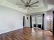 Light-filled bedroom with wood floors and sliding glass doors at 173 Portland Ave, Spring Hill, FL 34606