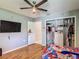 Comfortable bedroom with closet, hardwood floor, ceiling fan and natural light at 173 Portland Ave, Spring Hill, FL 34606