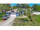 Beautiful home featuring solar panels, a two-car garage, and a well-maintained front lawn at 173 Portland Ave, Spring Hill, FL 34606