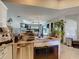 Open-concept kitchen featuring a granite countertop island and stainless steel appliances at 173 Portland Ave, Spring Hill, FL 34606