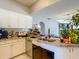 Bright kitchen featuring white cabinetry, stainless steel appliances, and a marble countertop sink at 173 Portland Ave, Spring Hill, FL 34606