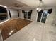 Modern living room featuring wood and tile floors, a fireplace, and sliding glass doors at 173 Portland Ave, Spring Hill, FL 34606