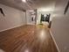 Inviting living room features beautiful wood floors and a large window at 173 Portland Ave, Spring Hill, FL 34606