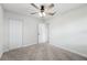 Bright bedroom featuring carpet, ceiling fan and closet at 2633 Keysville Dr, Lithia, FL 33547