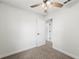 Freshly painted bedroom with carpet, ceiling fan and adjoining hallway at 2633 Keysville Dr, Lithia, FL 33547