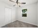 Clean, carpeted bedroom with bright window and closet at 2633 Keysville Dr, Lithia, FL 33547