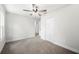 Clean bedroom with neutral carpet, closet and bright white walls at 2633 Keysville Dr, Lithia, FL 33547