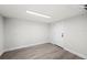 An additional bedroom with contemporary gray flooring, neutral paint and a white door at 2633 Keysville Dr, Lithia, FL 33547
