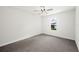 Bright bedroom with neutral carpet, ceiling fan, and window at 2633 Keysville Dr, Lithia, FL 33547