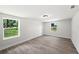 Spacious bedroom with modern flooring and large windows at 2633 Keysville Dr, Lithia, FL 33547