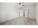 Cozy bedroom with neutral carpeting, ceiling fan, and access to a walk-in closet and bathroom at 2633 Keysville Dr, Lithia, FL 33547
