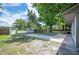 Wide driveway with parking leading to a backyard surrounded by trees at 2633 Keysville Dr, Lithia, FL 33547
