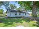 Charming home exterior featuring a fresh coat of paint and a well-kept lawn at 2633 Keysville Dr, Lithia, FL 33547