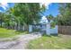 Inviting home entrance framed by a wooden fence and lush greenery at 2633 Keysville Dr, Lithia, FL 33547