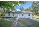 Charming single-story home featuring a well-maintained front yard, inviting entrance, and natural surroundings at 2633 Keysville Dr, Lithia, FL 33547