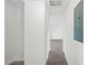 Hallway featuring modern gray flooring and neutral wall paint at 2633 Keysville Dr, Lithia, FL 33547