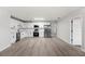 Open-concept kitchen with white cabinets, stainless appliances, and a spacious layout at 2633 Keysville Dr, Lithia, FL 33547