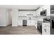 Modern kitchen featuring stainless steel appliances, white cabinets, and spacious countertops at 2633 Keysville Dr, Lithia, FL 33547
