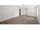 Bright living room featuring modern gray flooring and neutral wall paint at 2633 Keysville Dr, Lithia, FL 33547