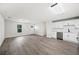 Spacious living room and modern kitchen with ample natural light and new stainless appliances at 2633 Keysville Dr, Lithia, FL 33547